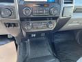 The dashboard of a 2019 Ford F-350 SD featuring controls for audio climate and various settings