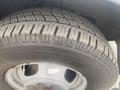 A close-up view of a tire from a 2017 Chevrolet Express showing detailed tread design and size LT225 75R16