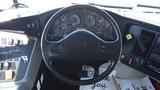 The interior dashboard of a 2014 International 3000 bus featuring a steering wheel and an array of gauges and controls