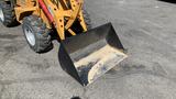 2024 Traner TR45 loader with a large black scoop attachment on the front showing some dirt inside the bucket