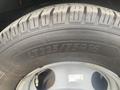 Close-up of a tire from a 2017 Chevrolet Express showing the tread pattern and sidewall details including the size LT225/75R16