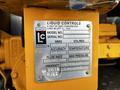 A yellow label on a 2013 Kenworth T370 truck displaying information about liquid controls model serial number flow rate and maximum pressure