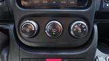 The control panel of a 2017 RAM Promaster featuring three circular knobs for car functions including A/C and vehicle settings