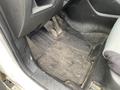 A worn and dirty floor mat in the driver's side of a 2016 Mazda CX-5 with visible dirt and debris accumulation