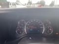 Dashboard of a 2017 Chevrolet Express showing speedometer fuel gauge and other instrument panels with various readings and lights illuminated