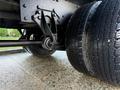 Close-up of a 2015 International 3000 truck's rear axle and dual tires showcasing the mechanical components and tread patterns of the tires