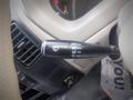 A black windshield wiper control stalk with settings labeled OFF INT LO HI