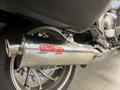 A chrome exhaust silencer labeled G.P.R. attached to a 2013 BMW K1600GTL motorcycle