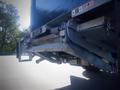 2013 Mitsubishi Fuso FE 160 rear-view showing the truck's bumper and trailer hitch with a metallic, industrial design