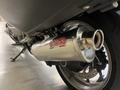 Close-up of the chrome exhaust system of a 2013 BMW K1600GTL motorcycle showcasing the GPR branding