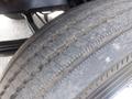 Close-up of a worn tire from a 2007 Morgan Olson Workhorse W42 showing visible tread patterns and wear marks