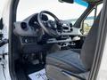 Interior of a 2022 Mercedes-Benz Sprinter showing the dashboard steering wheel and front seats