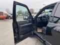 A 2017 Ford Expedition with the driver's side door open showcasing the interior dashboard and seating elements