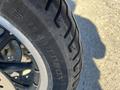 Close-up of a motorcycle tire with the word Davidson embossed on the sidewall showcasing tread patterns and detailing of the 2004 Harley-Davidson Flhtcui