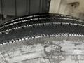 Close-up of a Hino 268 tire showing distinct tread patterns and wear with some visible markings on the surface