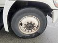 A close-up of a tire on a 2008 Hino 268 truck showing the wheel rim and lug nuts with a flat surface on the tire