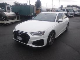 A 2020 Audi S4 in white with a sporty design featuring a distinctive front grille and sleek lines