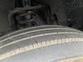 Close-up of a worn tire from a 2014 RAM 5500 showing tread patterns and dirt accumulation on the surface