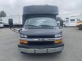 Front view of a 2017 Chevrolet Express van featuring a black exterior and chrome details with large side mirrors