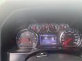 Dashboard of a 2015 Chevrolet Silverado 3500HD displaying various gauges including speedometer fuel range and warning lights