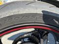 Close-up of a 2018 Triumph Street Triple RS rear tire showcasing tread pattern and markings including size 18055ZR17