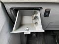 A gray storage compartment with three sections and a latch designed for a 2013 Toyota Sienna