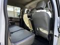 Interior of a 2017 Ford F-150 showing the rear seating area with two gray leather seats and a clean, spacious layout