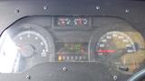 Dashboard of a 2011 Ford Econoline showing speedometer odometer and fuel gauge with various indicators illuminated