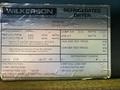 A metal label from a Wilkerson Refrigerated Air Dryer detailing model number serial number rated capacity fan specs and electrical requirements