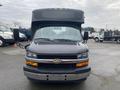 A black 2017 Chevrolet Express van with a high roof and front grille featuring the Chevrolet logo