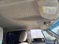 Interior view of a 2013 Ford Expedition showing the ceiling with a dome light and overhead console details