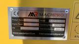 A metal placard displaying specifications for a MachPro MP-S300 skid steer including product name engine power operating mass and production date