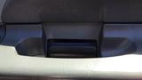 2006 Ford F-650 interior handle and armrest section with textured surface and contoured design