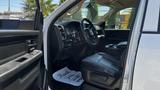 Interior view of a 2019 RAM 3500 showing the driver's seat steering wheel and dashboard with leather upholstery and a floor mat that says Thank You