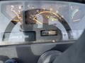 Dashboard of a 2003 John Deere 790 tractor displaying various gauges and a digital hour meter showing 1075 hours