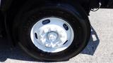 Close-up of a black Goodyear tire mounted on a white wheel of a 2013 International 7400 Workstar truck