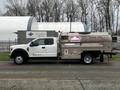 A white 2018 Ford F-550 fuel delivery truck with a metal tank on the back displaying Petro Canada branding and the text On-Site Refuelling