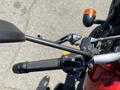 Close-up view of the handlebars of a 2022 Royal Enfield Himalayan showing the controls and levers