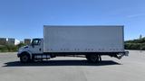 A white 2019 International 4300 box truck with a blank cargo area and visible wheels parked on a lot