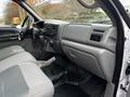 Interior of a 2008 Ford F-750 showing the front seats dashboard and control panel