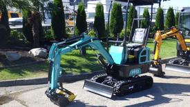 A 2023 FF Industrial FF 12 compact excavator with a teal and black design featuring a front bucket and tracks for mobility