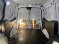 A 2022 Ford Transit Connect interior with a spacious cargo area featuring a flat floor and panelled walls designed for storage and transport