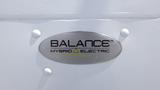 A logo on a vehicle displaying the text "BALANCE HYBRID ELECTRIC KREBS DYNAMICS"