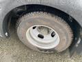 A close-up view of a tire mounted on a 2017 Chevrolet Express showing the wheel rim and tire details