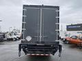 A 2018 Hino 308 truck with a grey box trailer viewed from the rear showing the double doors and rear bumper on a parking lot surface