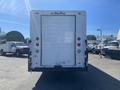 2007 Freightliner MT55 box truck with a white exterior and rear loading door positioned prominently in the foreground