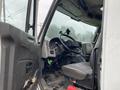 Interior view of a 2018 International 26 Foot Cube truck showing the driver's seat dashboard and steering wheel