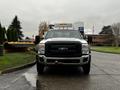 A 2015 Ford F-550 pickup truck facing forward with a prominent black grille and tow hitch attached