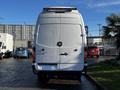 Rear view of a white 2008 Dodge Sprinter Van with a high roof and rear door handles visible