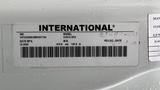 A vehicle identification label displaying the model International CV515 with VIN and manufacturing date details